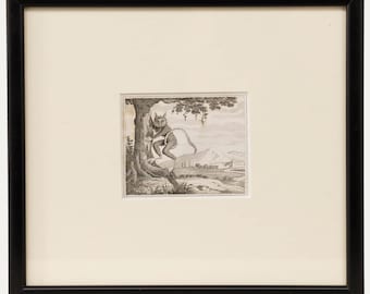 May include: A framed black and white etching depicts a cat-like creature perched in a tree, overlooking a landscape with a building and mountains. The artwork is set against an off-white mat and enclosed in a black frame.