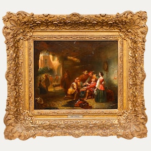 May include: An antique oil painting in a gold ornate frame. The artwork depicts a gathering of people in a courtyard, with figures in period clothing. The painting is signed "JOAN STROEBEL".