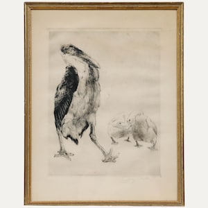 May include: A framed black and white etching of birds. The artwork depicts a large bird with its back turned, and two smaller birds in the background. The frame is gold-colored.