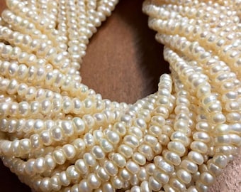 Fresh water pearls natural ivory color little rondelle pearls full 14inch strand