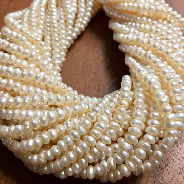 Fresh water pearls natural ivory color little rondelle pearls full 14inch strand