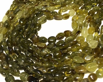 Grossular green garnet shaded smooth oval beads full 14" stand.