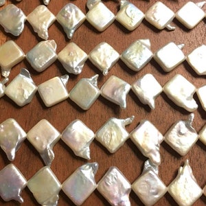 Diamond shaped pearls soft ivory color whole strand
