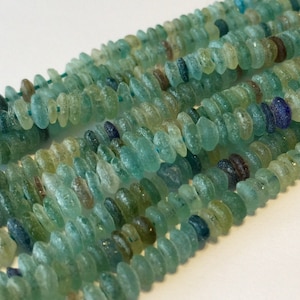 Ancient roman glass beads little rondelles saucers