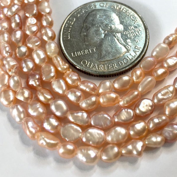 Tiny rice Keishi pink/peach fresh water pearls full 14inch strand