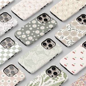 May include: Assortment of phone cases with various floral and geometric patterns. The cases are all white with different coloured designs.