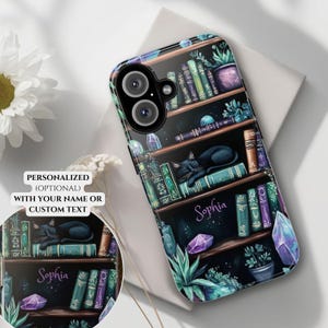 May include: A black phone case with a design of a bookshelf filled with books, crystals, and a black cat sleeping on a book. The text "Sophia" is written on the case.