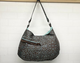 Women’s fashion hobo bag with fringed pocket, brown & turquoise floral shoulder bag, stylish on-the-go handbag for the busy woman