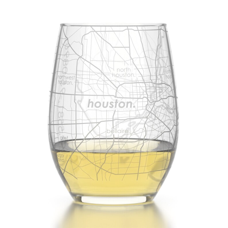 May include: A clear glass wine tumbler with a detailed etched map of Houston, Texas. The map includes the names of neighborhoods like "northwest houston", "north houston", "houston", and "bellaire".