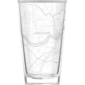 May include: A clear glass tumbler with a map of Cincinnati, Ohio printed on the side. The map shows the city's streets and major landmarks.