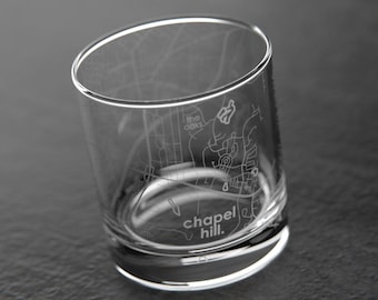 May include: A clear glass tumbler with an etched design of the Chapel Hill, North Carolina street map. The text "chapel hill." is etched at the bottom of the glass.