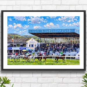 May include: A framed art print depicting a horse race at Clonmel Racecourse. The scene features jockeys in colourful silks riding horses across a green track, with a grandstand filled with spectators, a blue sky, and the text Clonmel Oil.
