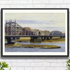 May include: Framed artwork featuring a detailed watercolor painting of two bridges over a river. The bridges are dark gray, with one having a truss design and the other an arched structure. The sky is a pale yellow with hints of blue.