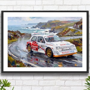 May include: A framed painting of a white rally car with red accents, speeding around a wet, winding coastal road. The car has gold wheels and the text "Rentokil Initial". The background shows a rugged coastline and cloudy sky.