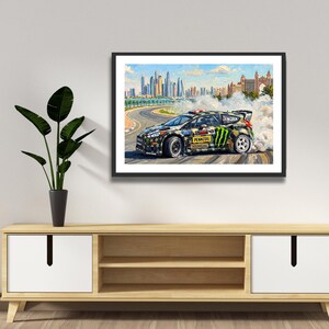 Ken Block Hoonigan Ford Fiesta ST RX43: Gymkhana 8 Dubai Impressionist Impasto Motorsport Print in a black frame hanging in a living room
