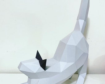 Peut inclure: Un modèle en papier blanc d'un chat qui s'étire avec des oreilles et une queue en papier noir.