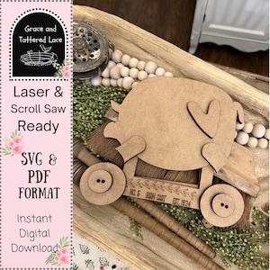 May include: A laser-cut wooden cart with heart details and button wheels. The cart has the text "NO. 5 FARM CART EST. 1924". The image also includes the text "Laser & Scroll Saw Ready" and "SVG & PDF FORMAT".