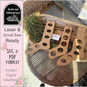 May include: Three brown wooden sock forms with circular cutouts are displayed on a wooden tray. The forms are for laser and scroll saw projects. The image also includes text that says "Laser & Scroll Saw Ready" and "SVG & PDF FORMAT".