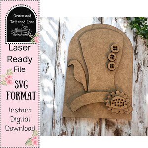 May include: A wooden cutout design for a laser-ready SVG file. The design features a hat with three buttons, a bird, and a sunflower. The text on the left side reads "Grace and Tattered Lace", "Laser Ready File", "SVG FORMAT", and "Instant Digital Download".
