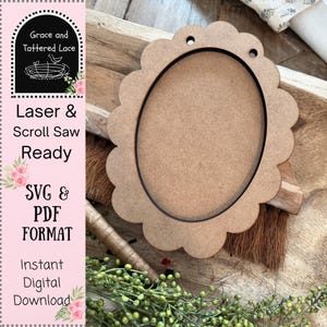 May include: A laser-cut, unfinished wooden oval frame with a scalloped edge. The frame has two small holes at the top for hanging. The image also includes text that reads "Grace and Tattered Lace", "Laser & Scroll Saw Ready", "SVG & PDF FORMAT", and "Instant Digital Download".