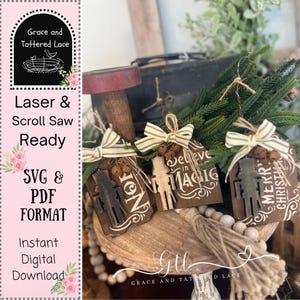 May include: Wooden Christmas ornaments with a rustic design. Each ornament features a cutout of a nutcracker and festive text like "Noel" and "Merry Christmas." They are adorned with striped bows and small bells, perfect for holiday decor.