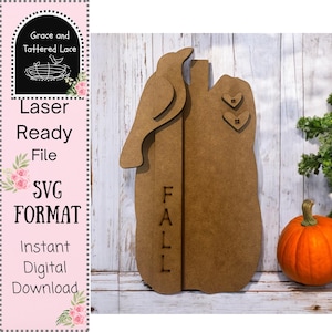 May include: A laser-cut wooden pumpkin decoration with a bird silhouette, the word "FALL", and two heart-shaped accents. The design is a digital SVG file, ready for laser cutting. The image also includes a small pumpkin.