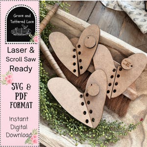 May include: Wooden heart-shaped cutouts with a circular accent and a series of holes along the edges. The image also includes text that reads "Laser & Scroll Saw Ready" and "SVG & PDF FORMAT".