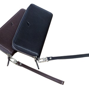 Portemonnee met ritssluiting, verkrijgbaar in zwart of bruin, met afneembare polsband en compatibel met smartphones. Handtas