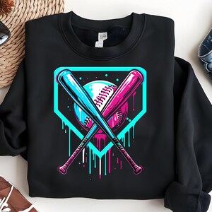 May include: Black sweatshirt with a graphic of two baseball bats crossed over a baseball in a home plate. The graphic is in neon blue, pink, and white colors with dripping paint.