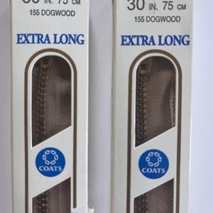 May include: Two identical packages of Coats brand extra long zippers in the color 155 Dogwood. Each white cardboard packaging displays the text 30 IN. 75 CM, 155 DOGWOOD, and EXTRA LONG, with a visible brown zipper inside the clear plastic window.