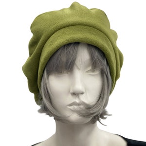 Olive green fleece beret satin lined winter hat modeled on a hat mannequin. Handmade by Boston Millinery front view