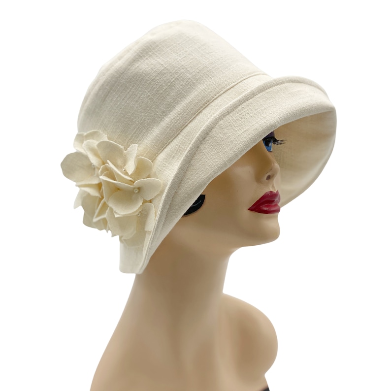 1920s Accessories: Feather Boas, Cigarette Holders, Flasks     Wedding Hat in Cream Linen 1920s Cloche Hat Summer Hydrangea Flower Brooch Mother of the Bride Gift Handmade  AT vintagedancer.com