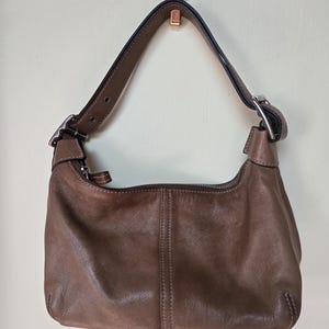 This is a Vintage Coach Demi Legacy Hobo Camel Color Bag Measuring