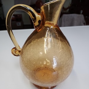 Blenko glass amber crackle glass pitcher. This is a beautiful blenko piece that would look awesome in any kitchen or formal room