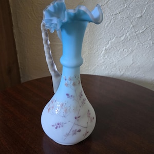 Vintage Mt. Washington cased blue satin glass hand painted vase in mint shape. This piece is beautiful!