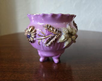 This is a Victoria Era 4 toed pink luster ware gold gilded tea cup hand painted. How beautiful!