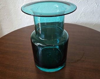 This is a beautiful blenko bluish green flat wide rim vase measuring 8&quot; tall x 5.5&quot; wide with thick glass bottom vase. what a gorgeous piece