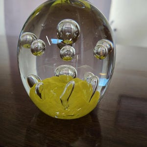 Beautiful MCM art glass controlled bubble with yellow footing Egg shaped paperweight.