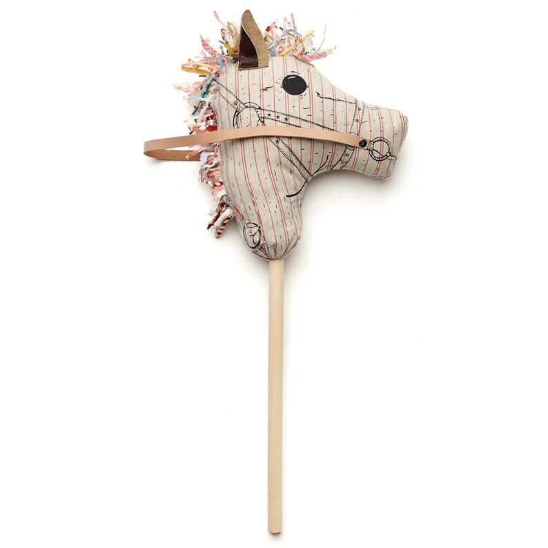Baby Horse With Red Stripes On A Wood Stick Bébé Cheval Image 0