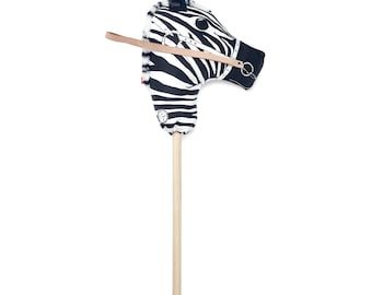 Baby zebra on a wood stick /// Bébé zèbre sur bâton de bois