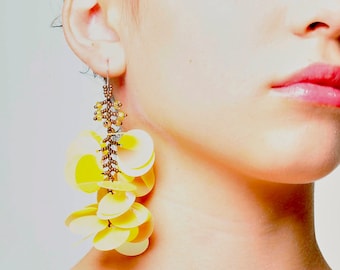 Long dangling statement earrings made with large lemon yellow sequin paillettes