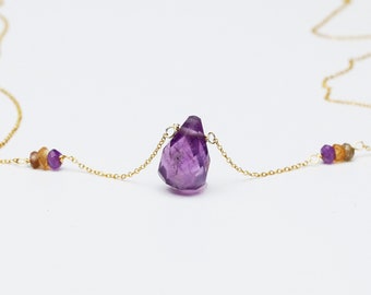 Purple amethyst teardrop gemstone necklace with amethyst and sapphire micro beads on gold colored chain