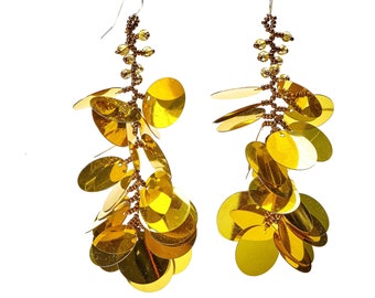 Long dangling oversized earrings made with lightweight gold sequin paillettes and yellow glass seed beads
