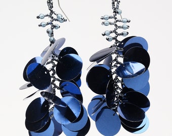 Long dangling statement earrings made with large navy blue sequin paillettes