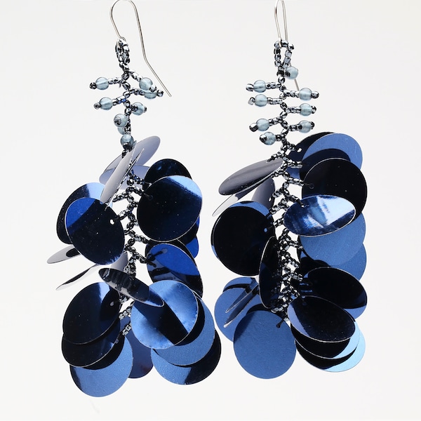 Long dangling statement earrings made with large navy blue sequin paillettes