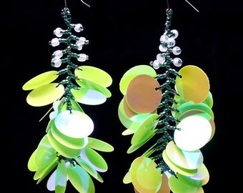 Long dangling statement earrings made with large light lime green sequin paillettes and glass seed beads