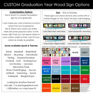 May include: Customizable graduation year wood sign options. The sign is 10.5 inches by 2 inches and comes with a metal hanger. The sign features a black background with white letters and a choice of colours for the letters. The sign can be customized with a variety of sports and themes.