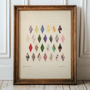 May include: A framed artwork featuring a collection of colorful diamond-shaped fabric swatches. The swatches display various patterns and colors, including red, green, blue, and purple. The artwork is set against a cream-colored background and framed in a wooden frame.