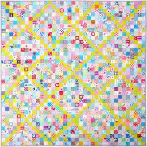 May include: A patchwork quilt with a yellow background and a variety of colorful squares. The squares are made of different fabrics and patterns, including floral, geometric, and polka dot.
