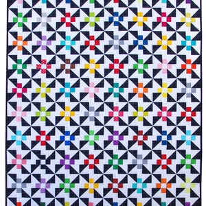 May include: A colorful quilt with a geometric pattern of black and white triangles and squares. The squares are in various colors, including red, blue, green, yellow, and pink.